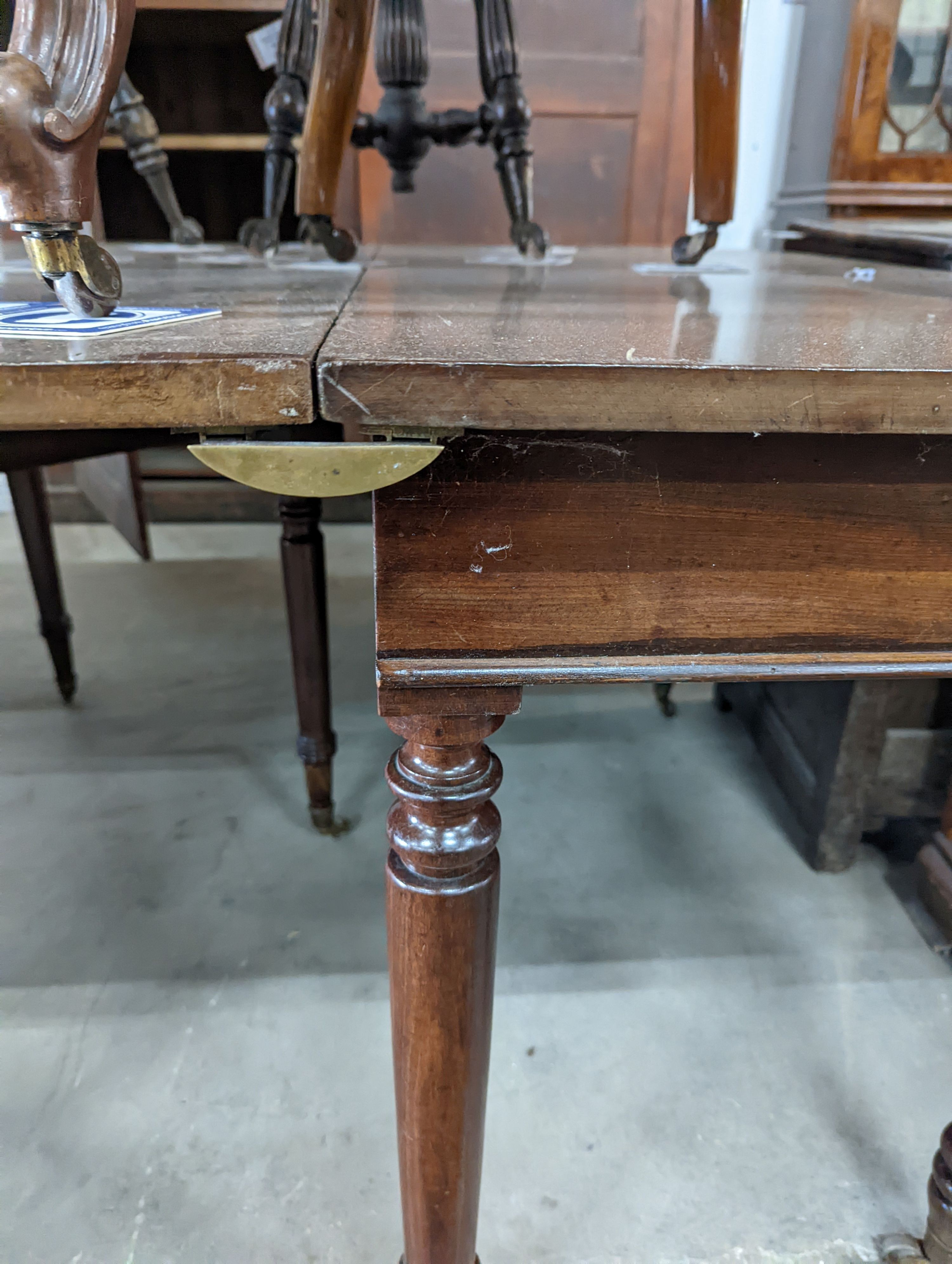 A George IV mahogany D end drop leaf extending dining table, 266cm extended, width 121cm, height 74cm